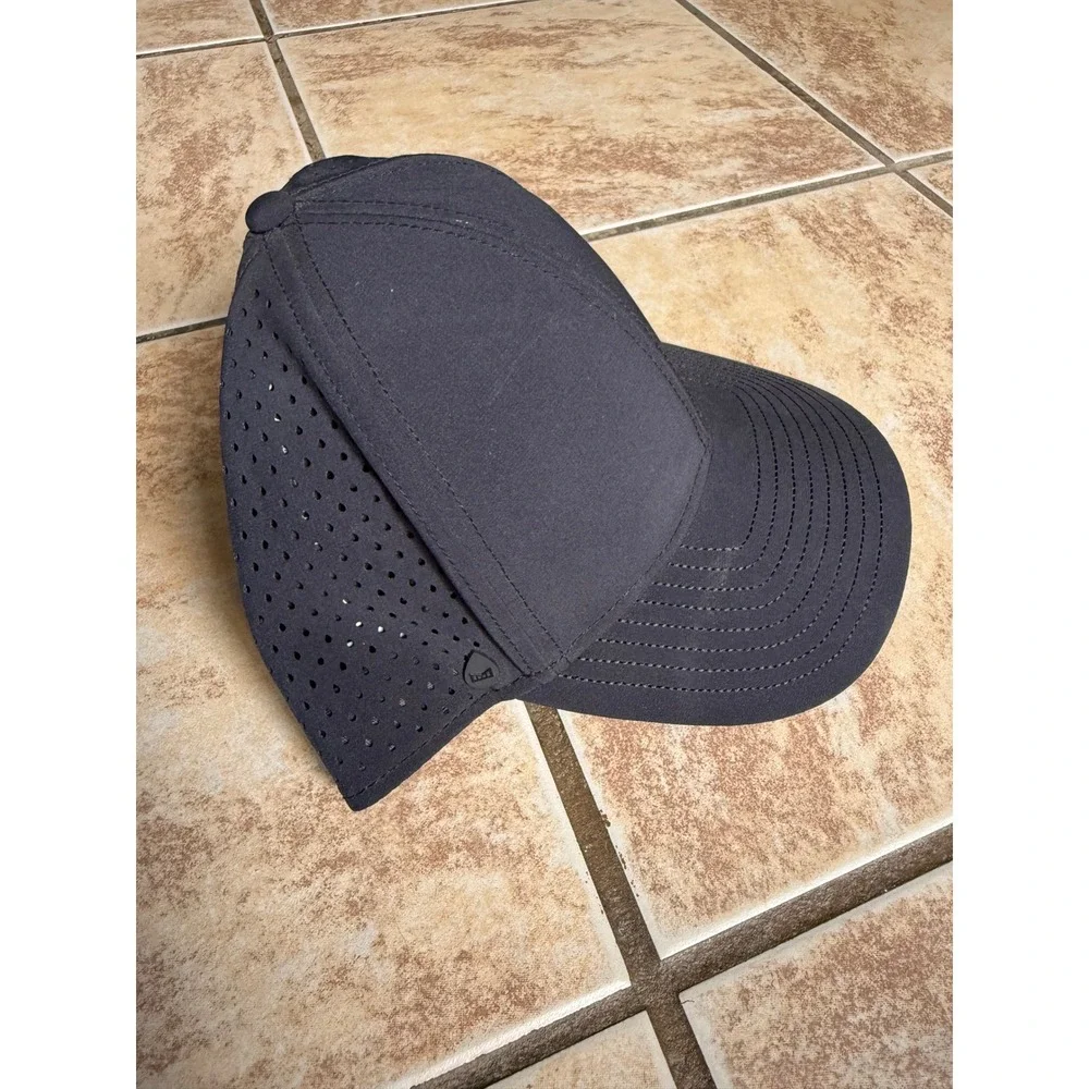 Melin A-Game Hydro Black Performance Snapback Hat 60cm L/XL Water Resistant